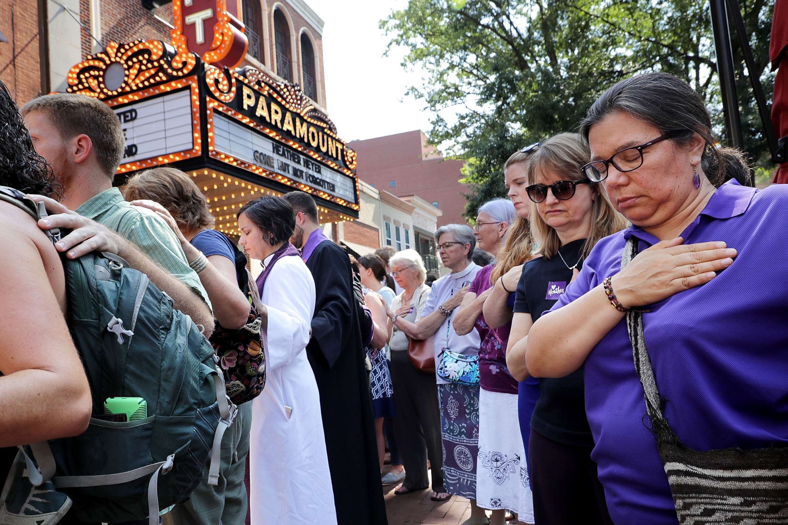 PHOTO: Clergy observe a moment of silence during the memorial service for Heather Heyer outside the Paramount Theater, Aug. 16, 2017 in Charlottesville, Va.