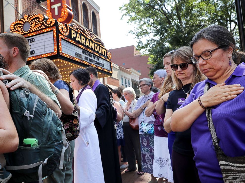 PHOTO: Clergy observe a moment of silence during the memorial service for Heather Heyer outside the Paramount Theater, Aug. 16, 2017 in Charlottesville, Va.
