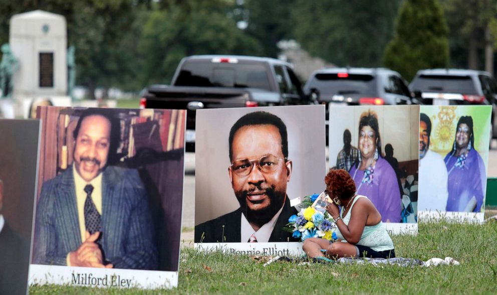 PHOTO: Images of Detroit residents whoâve died of COVID-19 line the street during a drive-thru memorial on Belle Isle in Detroit, Sept. 1, 2020.