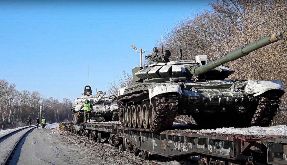 PHOTO: In this photo taken from video provided by the Russian Defense Ministry Press Service, Feb. 16, 2022, Russian army tanks are loaded onto railway platforms to move back to their permanent base after drills in Russia. 