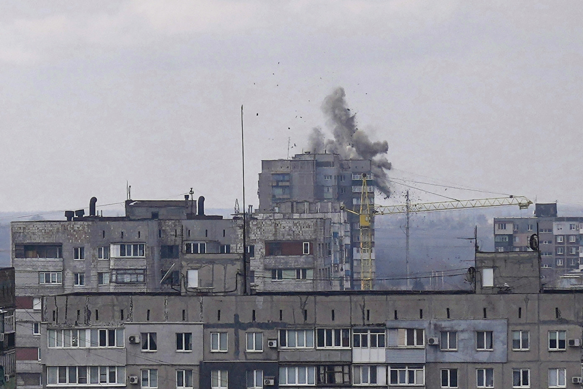 PHOTO: Explosions are seen during shelling in a residential district in Mariupol, Ukraine, March 10, 2022. 