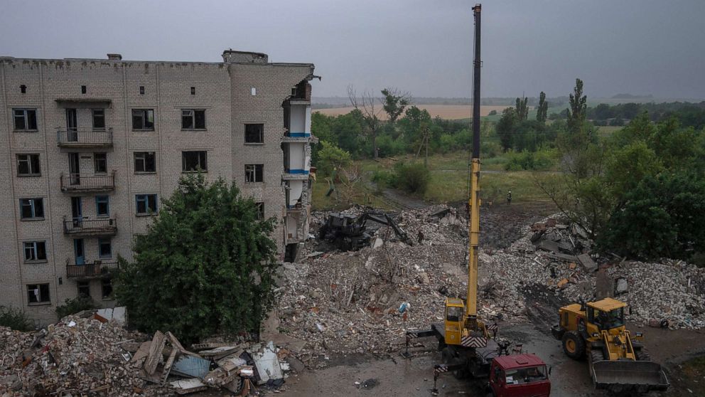 PHOTO: Ukrainian emergency workers labor to pull people out of the rubble after a Russian rocket attack smashed into apartment buildings, in Chasiv Yar, Donetsk region, eastern Ukraine, July 11, 2022.