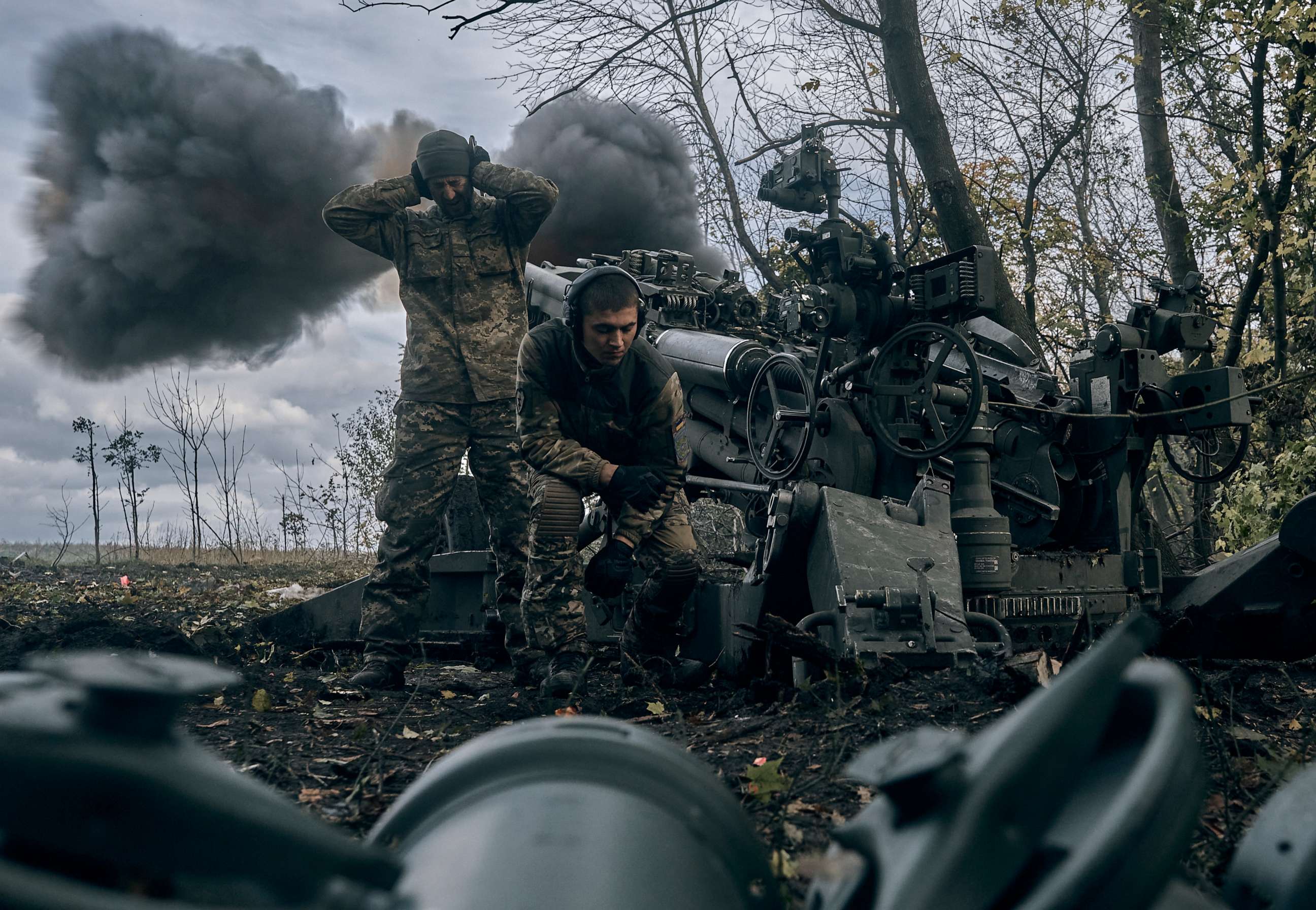 PHOTO: Ukrainian soldiers fire at Russian positions from a U.S.-supplied M777 howitzer in Ukraine's eastern Donetsk region, Oct. 23, 2022.