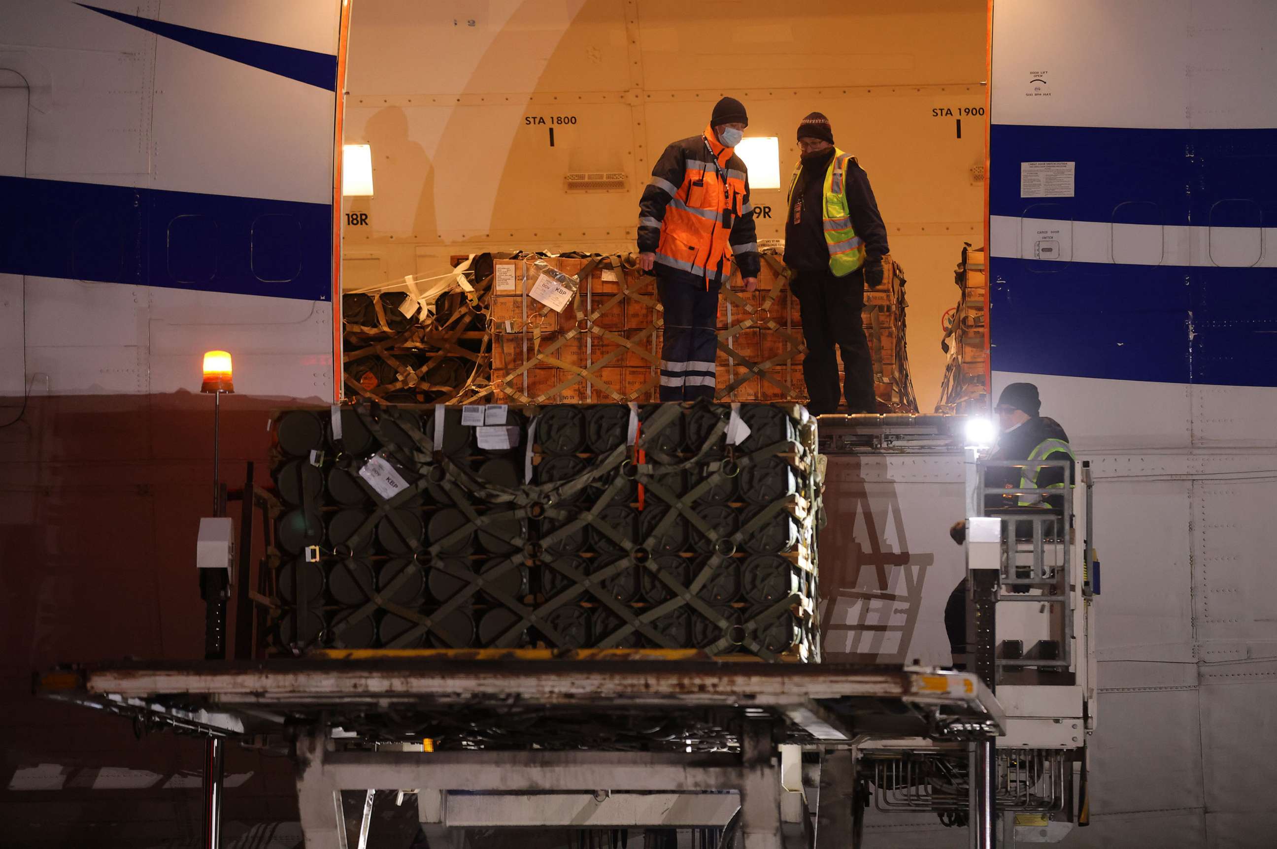 PHOTO: Ground personnel unload weapons, including Javelin anti-tank missiles, and other military hardware delivered on a National Airlines plane by the United States military at Boryspil Airport near Kyiv, Jan. 25, 2022, in Boryspil, Ukraine.