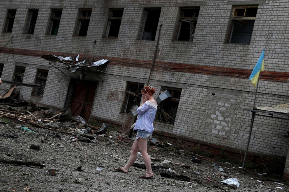 PHOTO: A warehouse staff member inspects her damaged workplace after a strike, amid Russia's attack on Ukraine, in the outskirt of Kharkiv, Ukraine June 3, 2022. 