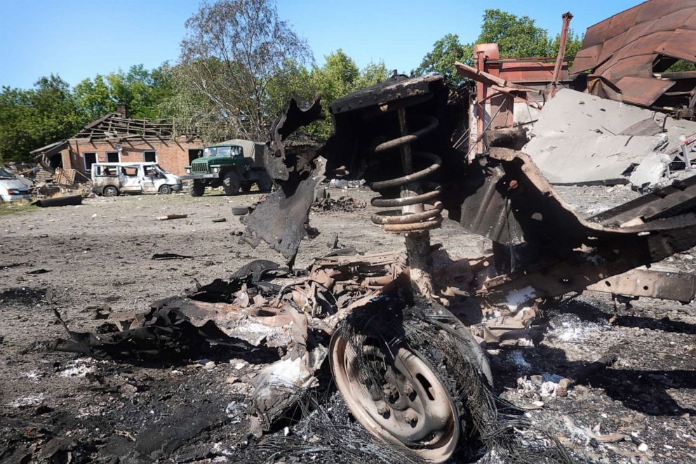 PHOTO: Debris litters the area after a projectile and subsequent fire destroyed a warehouse building the previous evening on June 21, 2022 in Druzhkivka, Ukraine.