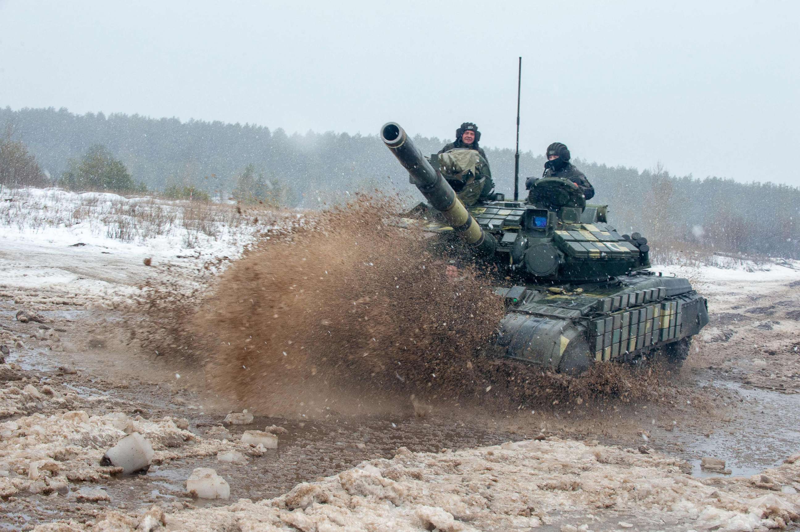 PHOTO: Ukrainian Military Forces servicemen of the 92nd mechanised brigade use tanks, self-propelled guns and other armoured vehicles to conduct live-fire exercises near the town of Chuguev, Kharkiv region, Feb. 10, 2022. 