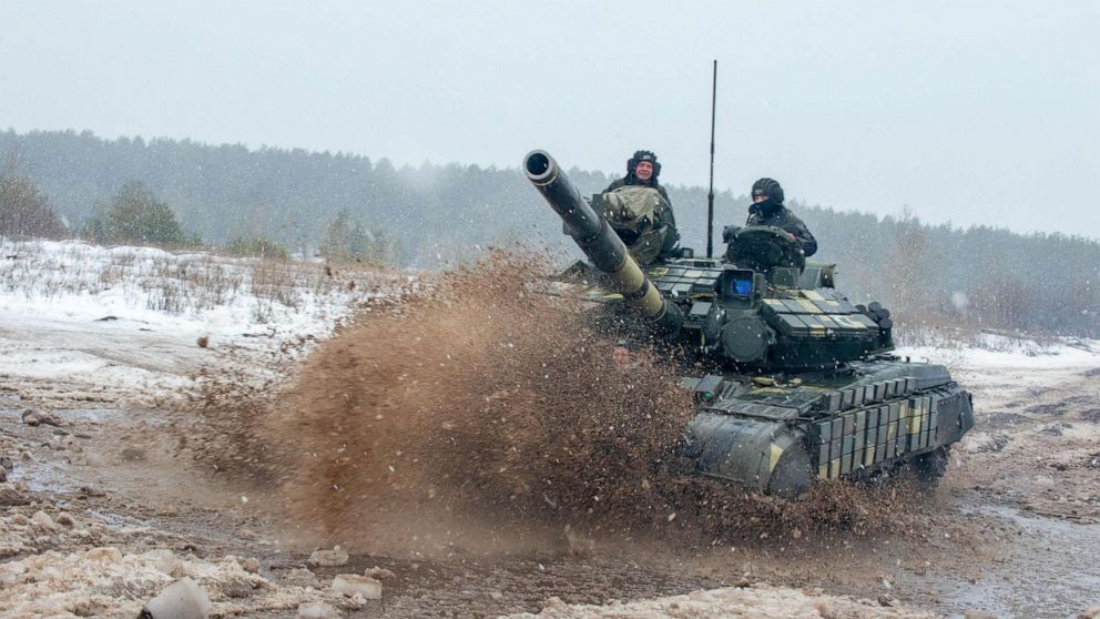 PHOTO: Ukrainian Military Forces servicemen of the 92nd mechanised brigade use tanks, self-propelled guns and other armoured vehicles to conduct live-fire exercises near the town of Chuguev, Kharkiv region, Feb. 10, 2022. 