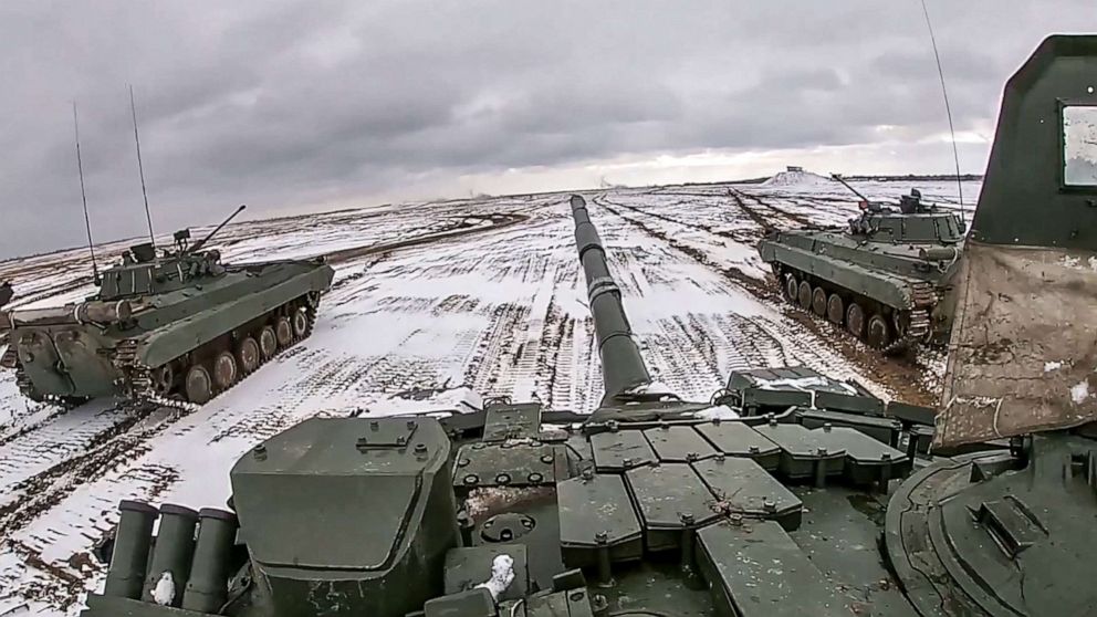 PHOTO: Tanks from the Russia and Belarus armed forces participate in joint exercises on a snow-covered field during joint exercises at a firing range in Belarus.