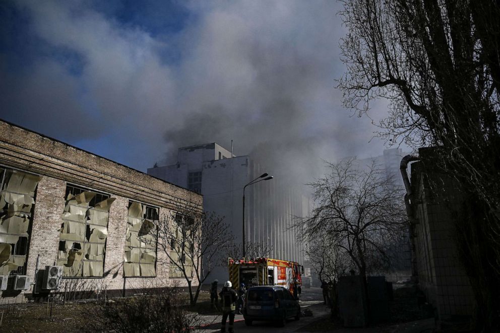 PHOTO: Firefighters are seen as smoke billows from a building of a research institute, part of Ukraine's National Academy of Science, after a strike in northwestern Kyiv, on March 22, 2022.