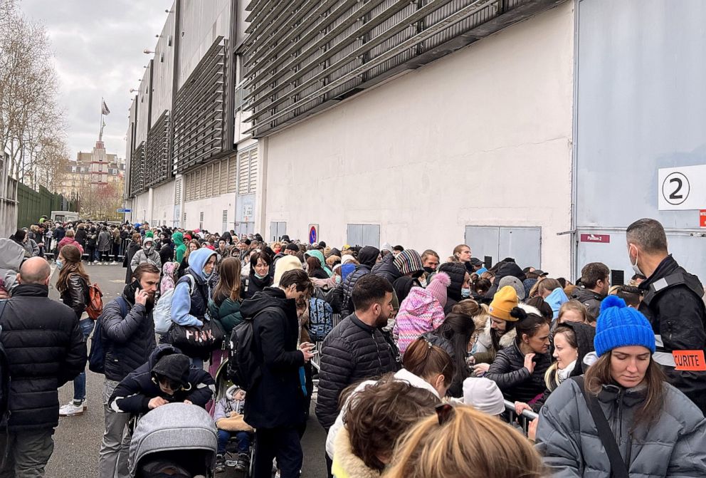 PHOTO: Ukrainian refugees in France line up to fill out paperwork on March 17, 2022.