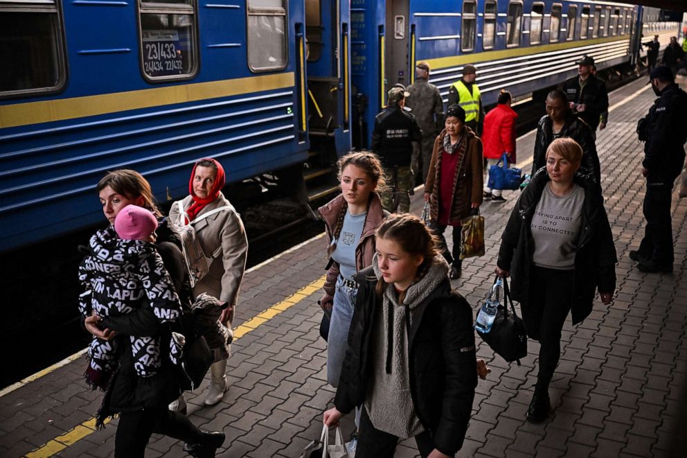 PHOTO: People, mainly women and children, arrive at Przemysl train station after travelling on a train from war-torn Ukraine, on March 22, 2022, in Przemysl Poland.