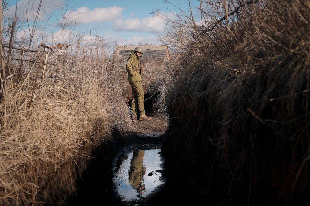 PHOTO: A Ukrainian serviceman pauses while walking to a frontline position outside Popasna, in the Luhansk region, eastern Ukraine, Sunday, Feb. 20, 2022.