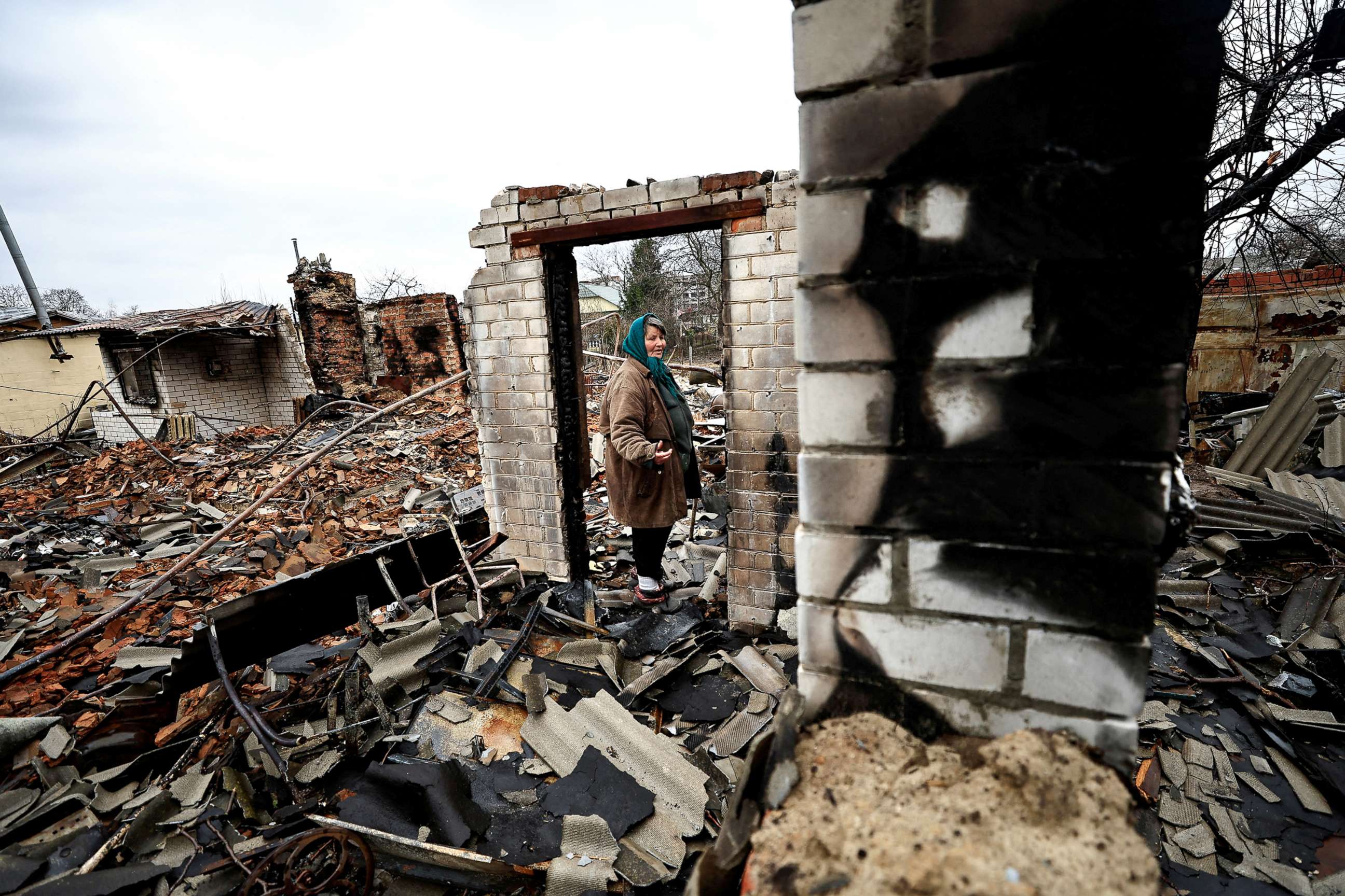 PHOTO: Natalia Titova, 62, reacts as she shows her house, which was destroyed by Russian shelling, amid Russia's Invasion of Ukraine in Chernihiv, Ukraine April 9, 2022. 