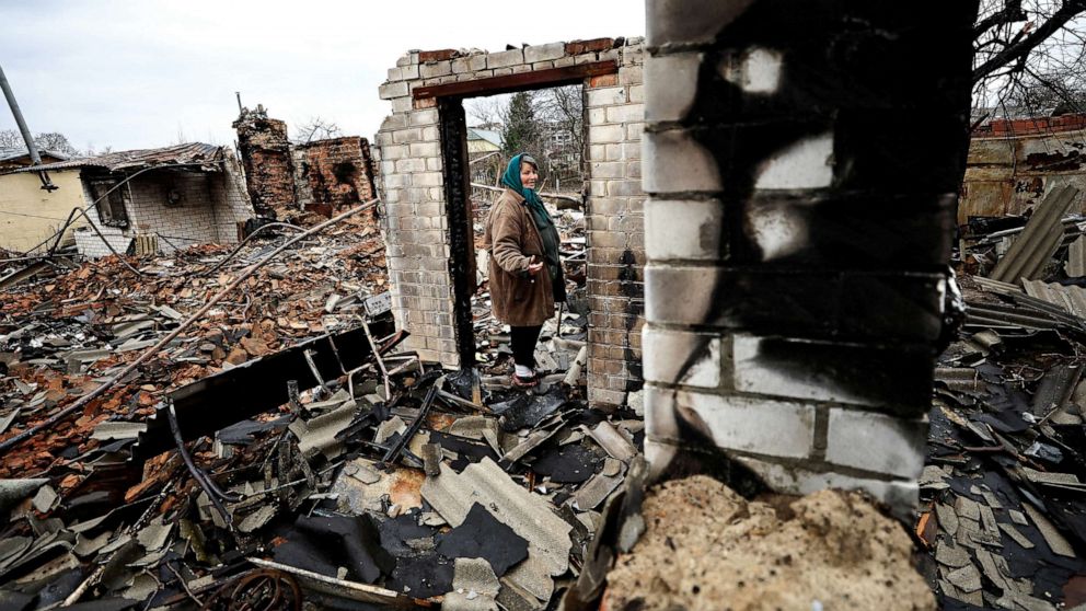PHOTO: Natalia Titova, 62, reacts as she shows her house, which was destroyed by Russian shelling, amid Russia's Invasion of Ukraine in Chernihiv, Ukraine April 9, 2022. 