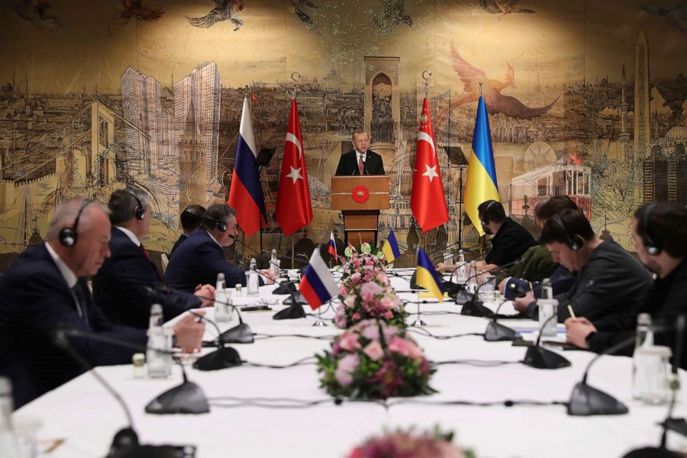 PHOTO: Turkey's President Recep Tayyip Erdogan gives a speech to welcome the Russian, left, and Ukrainian, right, delegations ahead of their talks in Istanbul on March 29, 2022.