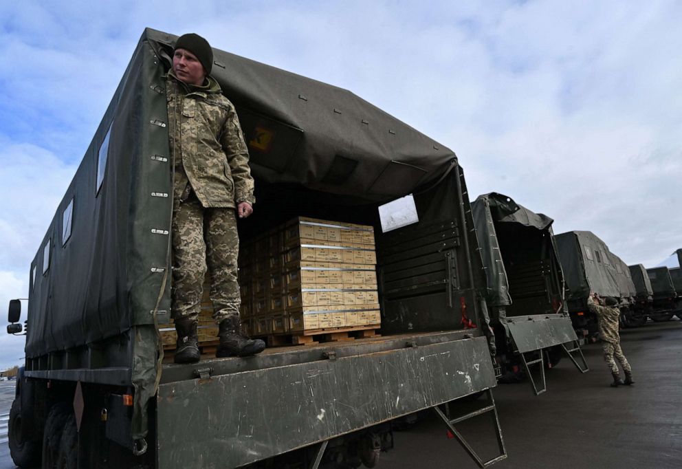 PHOTO: Servicemen of Ukrainian Military Forces Employees load trucks with US military aid at Kyiv's Boryspil airport on Feb. 9, 2022.