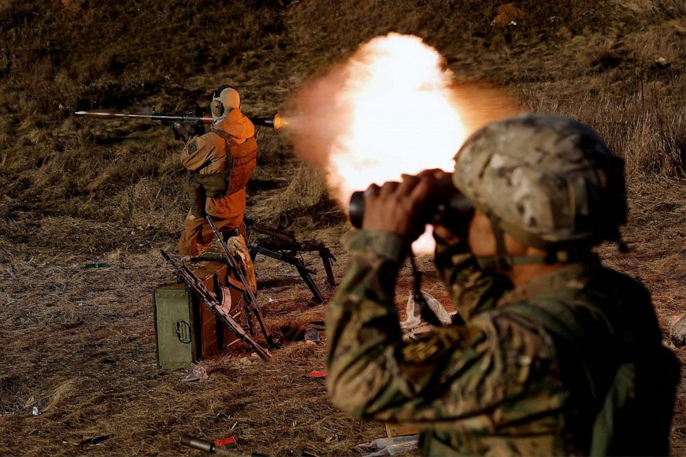 PHOTO: A soldier from Carpathian Sich international battalion fires an RPG while conducting manoeuvres near the front line, as Russia's attack on Ukraine continues, near Kreminna, Ukraine, Jan. 3, 2023.