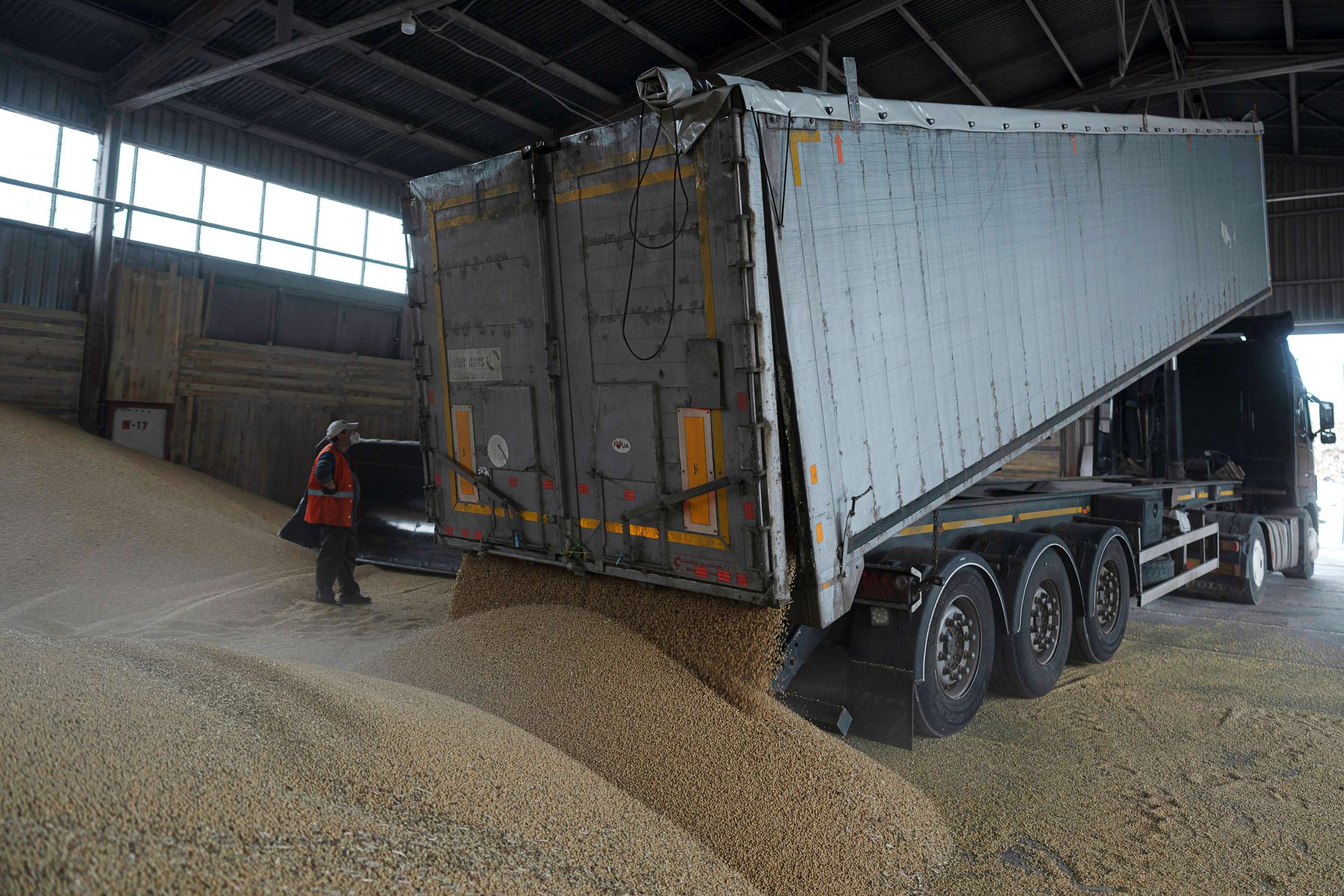 PHOTO: A truck unloads grain at a grain port in Izmail, Ukraine, April 26, 2023. U.S. and European officials have toured Ukraine's southern port of Izmail, a facility that is important in bringing Ukrainian grain exports to the world.
