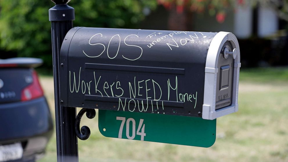 PHOTO: A plea for help is written on the mailbox of the home of a recently furloughed employee of Disney World, April 13, 2020, in Kissimmee, Fla.