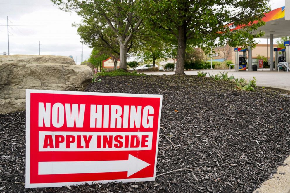 Hiring signs are posted outside a gas station in Cranberry Township, Butler County, Pennsylvania, on May 5, 2021. 