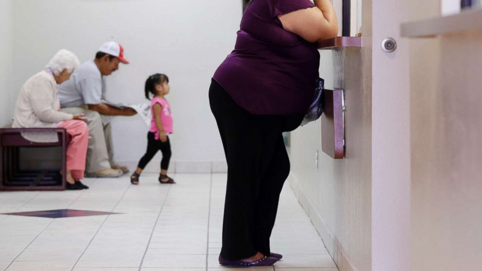 PHOTO: In this July 12, 2012 photo, a woman stands at the registration window at Nuestra Clinica Del Valle in San Juan, Texas.