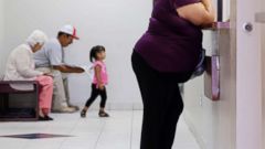 PHOTO: In this July 12, 2012 photo, a woman stands at the registration window at Nuestra Clinica Del Valle in San Juan, Texas.