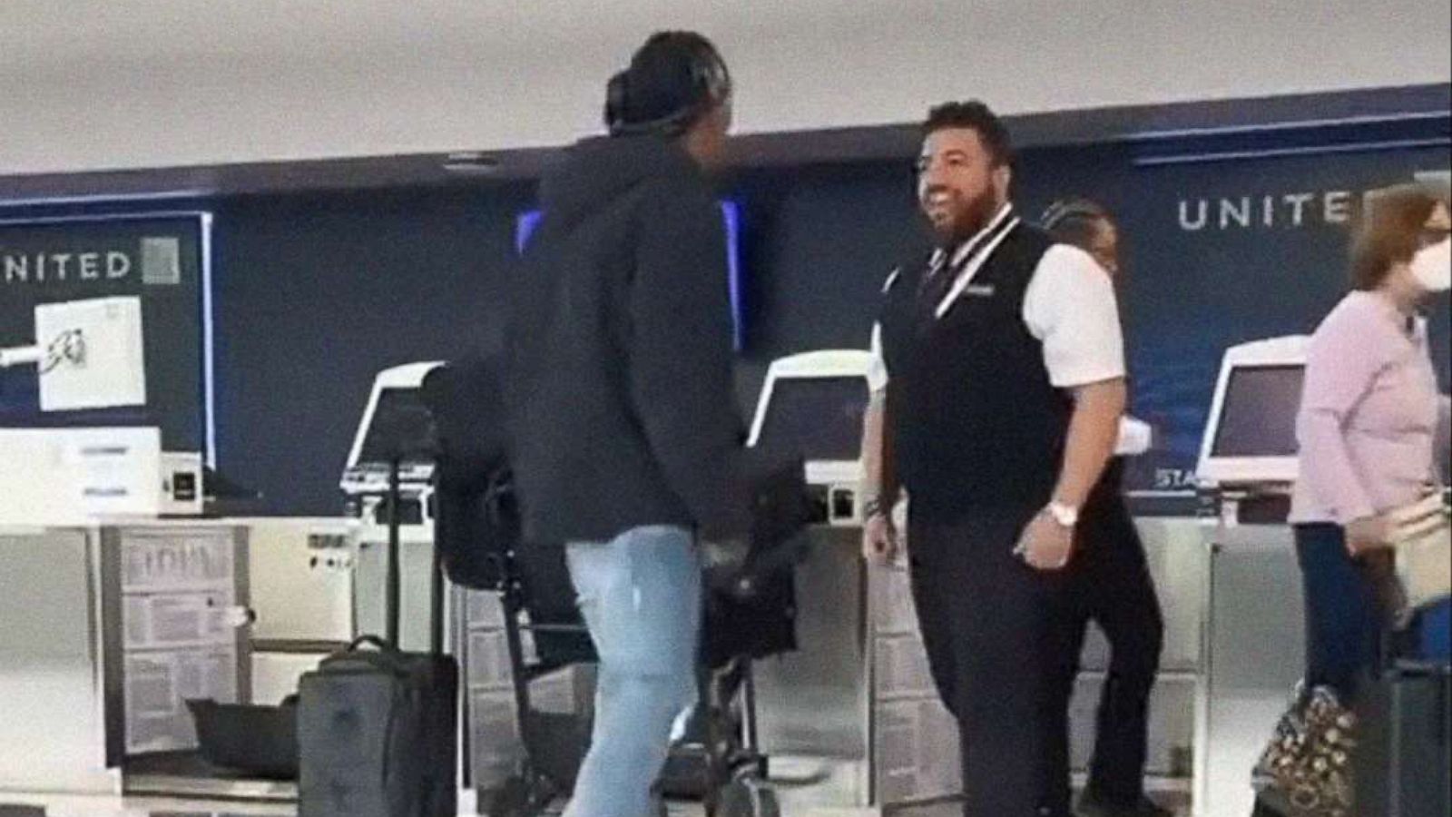 PHOTO: An altercation between a United ticket agent employee and Brendan Langley, at Newark Airport on Thursday, May 19, 2022, is pictured in an image from video made by a bystander. According to United, the employee has been fired upon reviewing video.