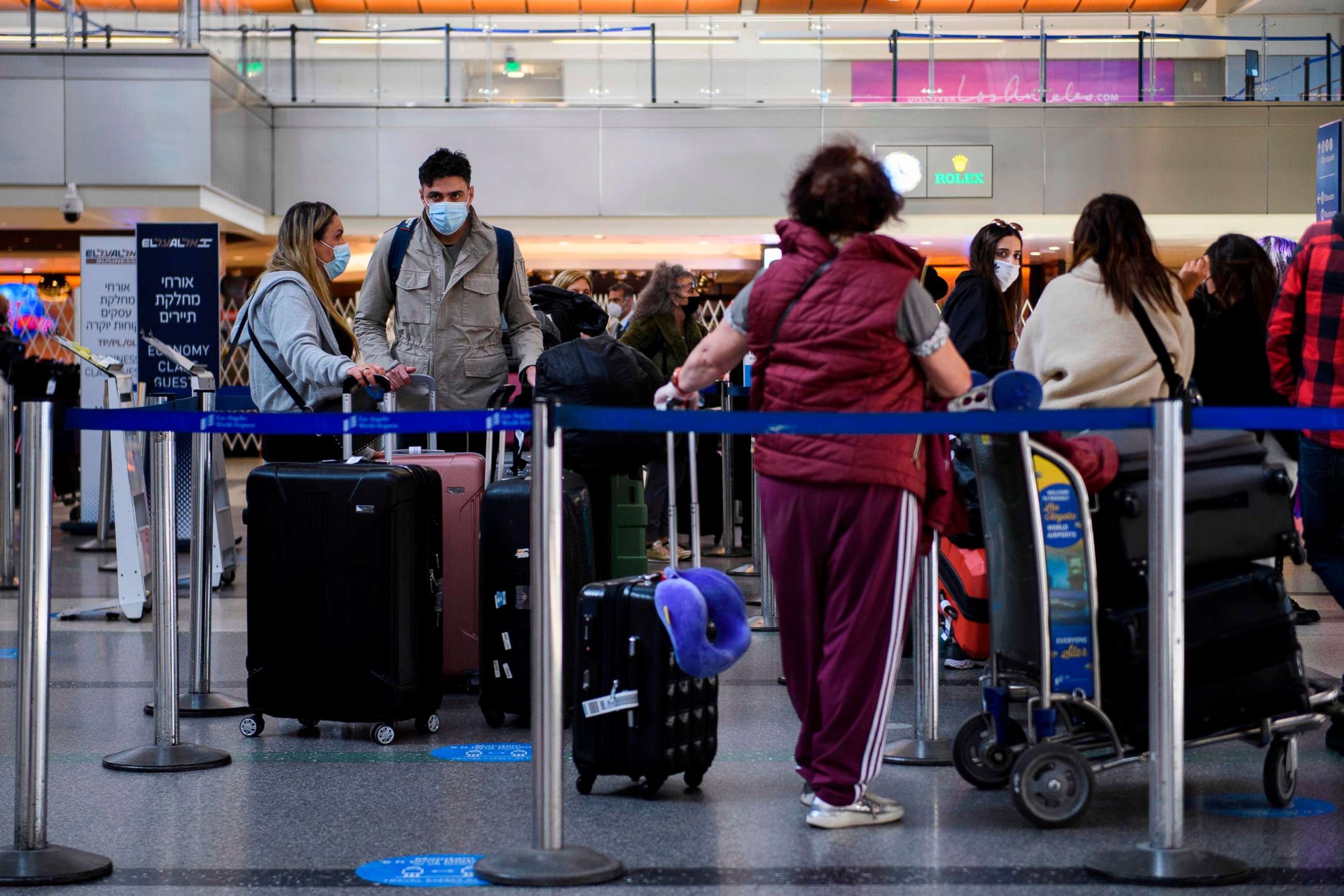 PHOTO: Travelers check-in for a flight inside the Tom Bradley International Terminal at Los Angeles International Airport amid increased COVID-19 travel restrictions, Jan. 25, 2021, in Los Angeles.