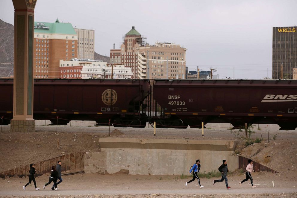 PHOTO: Migrants are pictured after crossing illegally to the United States to turn themselves in to request asylum to U.S. Customs and Border Protection officials in El Paso, Texas, April 17, 2019.