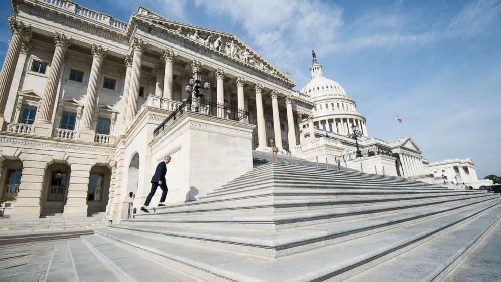 Rep. John Katko, R-N.Y., walks up the House steps for votes in the Capitol, Nov. 3, 2017.