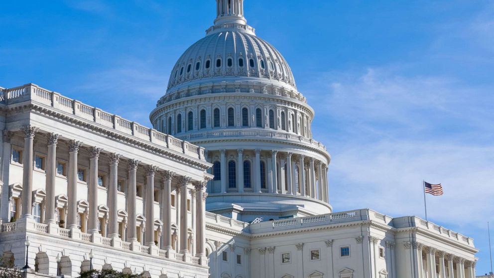 West facade of the United States Capitol in the early morning.