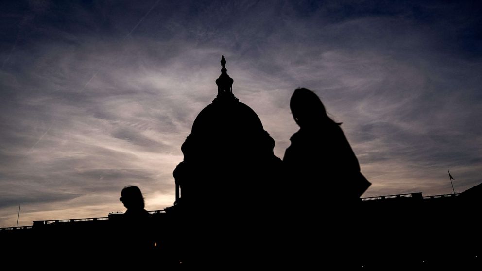 PHOTO: Visitors walk past the US Capitol in Washington, DC, on March 14, 2022.