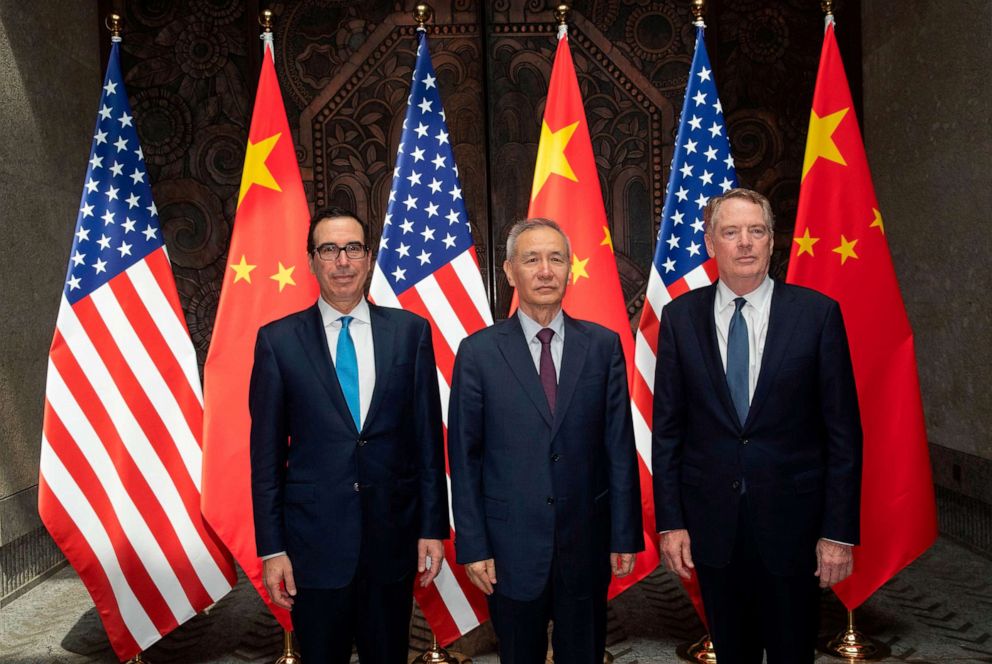 PHOTO: Chinese Vice Premier Liu He (C) with United States Trade Representative Robert Lighthizer (R) and Treasury Secretary Steven Mnuchin (L) pose for photos before holding talks at the Xijiao Conference Center in Shanghai, July 31, 2019.