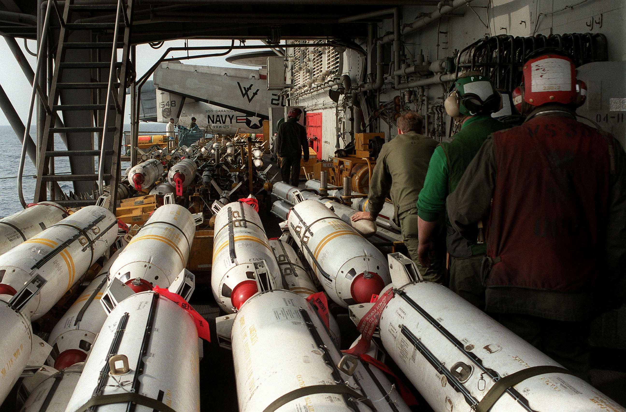 PHOTO: In this March 22, 1986, file photo, U.S. Navy aviation ordnancemen stage Mark 20 Rockeye II cluster bombs aboard an aircraft carrier in the Mediterranean Sea in this U.S. Navy handout photo.