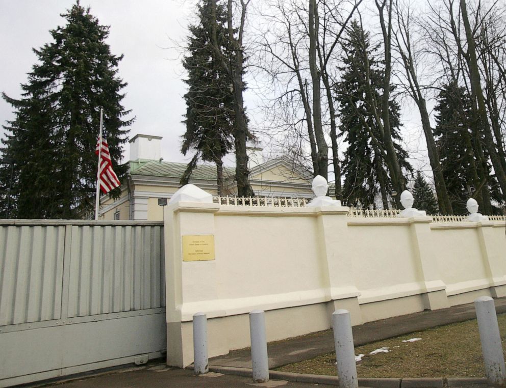 PHOTO: The US flag is seen behind a fence for the US embassy in Minsk, Belarus, on March 07, 2008.