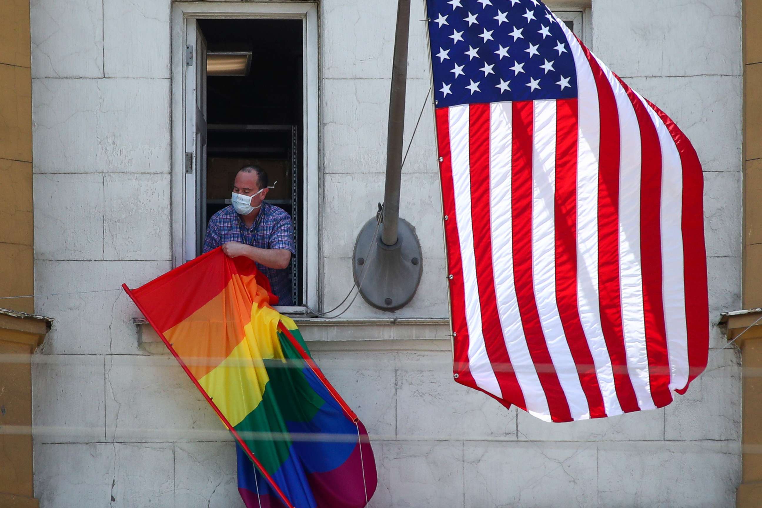 PHOTO: The US national flag and an LGBT pride flag on the front facade of the US Embassy in Moscow, June 25, 2020.