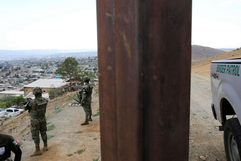 PHOTO: A U.S. Customs and Border Protection vehicle parks next to border fence between Mexico and U.S. as seen from Tijuana, Mexico, July 23, 2019.