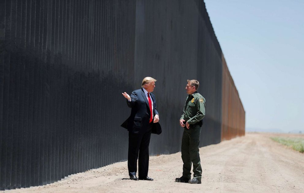PHOTO: President Donald Trump talks with U.S. Border Patrol Chief Rodney Scott as he tours a section of the U.S.-Mexico border wall in San Luis, Ariz., June 23, 2020.