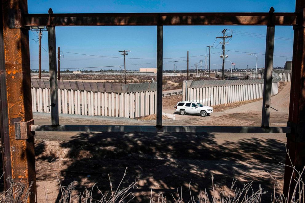 PHOTO: A truck drives near a reinforced section of the U.S.-Mexico border fence as seen from Tijuana, Baja California, Mexico, Oct. 22, 2018.