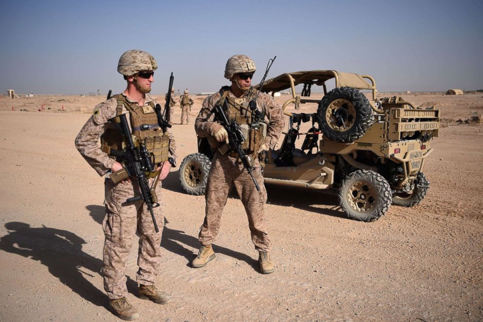 PHOTO: U.S. Marines keep watch as unseen Afghan National Army soldiers participate in a training exercise at the Shorab Military Camp in Lashkar Gah in the Afghan province of Helmand, Aug. 28, 2017.