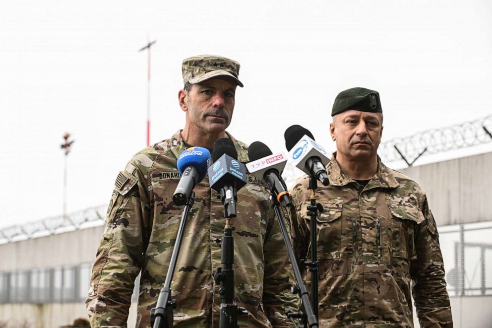 PHOTO: U.S. Army General Christopher Donahue, center, and Polish Army General Wojciech Marchwica walk together after a press briefing at Jasionka Rzeszow Airport, Feb. 6, 2022 in Rzeszow, Poland.