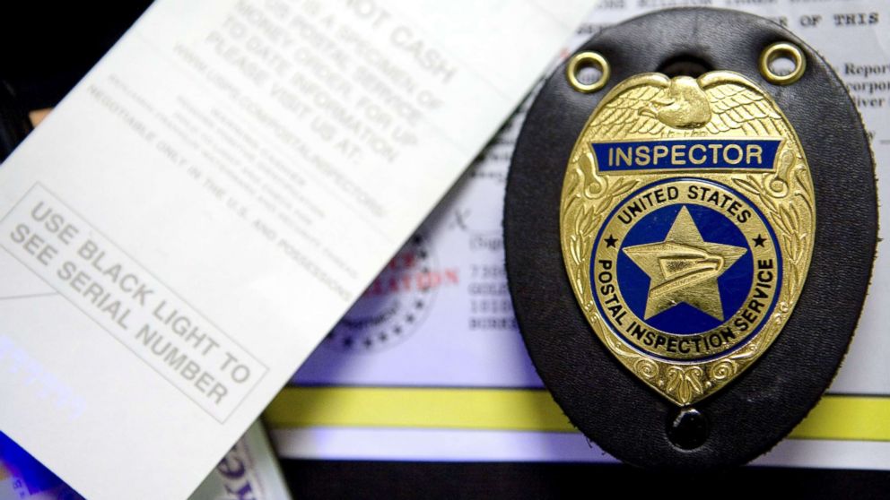 A badge belonging to the U.S. Postal Inspection Service is seen in this Aug. 4, 2008, photo.