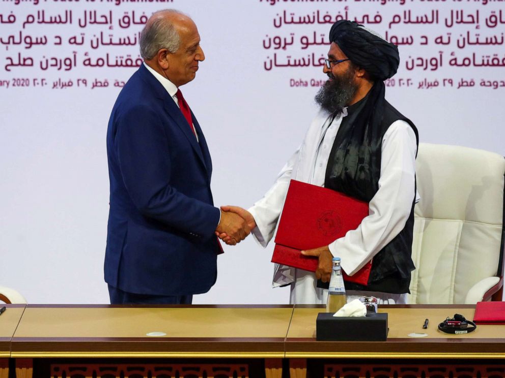 PHOTO: Mullah Abdul Ghani Baradar, the leader of the Taliban delegation, and Zalmay Khalilzad, U.S. envoy for peace in Afghanistan, shake hands after signing an agreement at a ceremony in Doha, Qatar, Feb. 29, 2020.