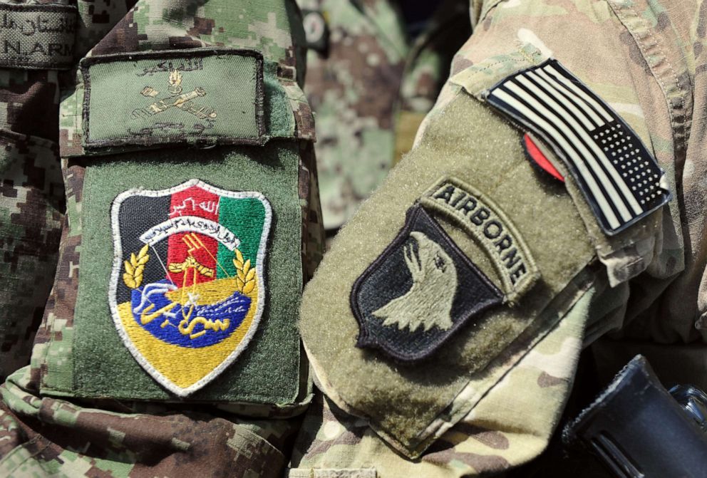 PHOTO: This picture taken on April 11, 2013, shows the badges of a U.S. soldier and a soldier of the Afghan National Army during a training session of ANA soldiers at the U.S. Shinwar Forward Base in the province of Nangarhar, Afghanistan.