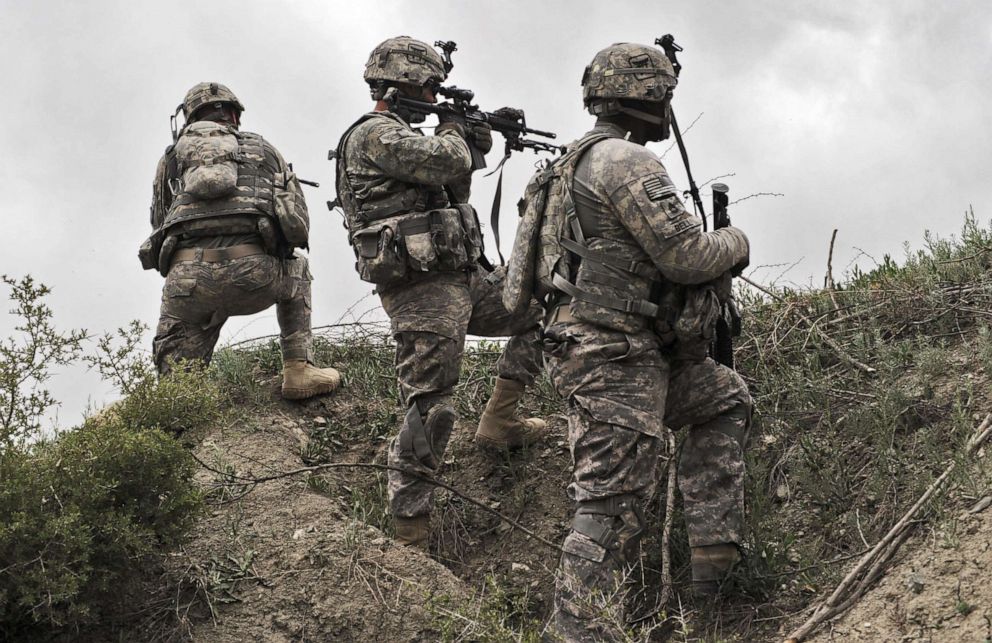 U.S. soldiers take position during a patrol in Ibrahim Khel village of Khost province in Afghanistan on April 11, 2010. 