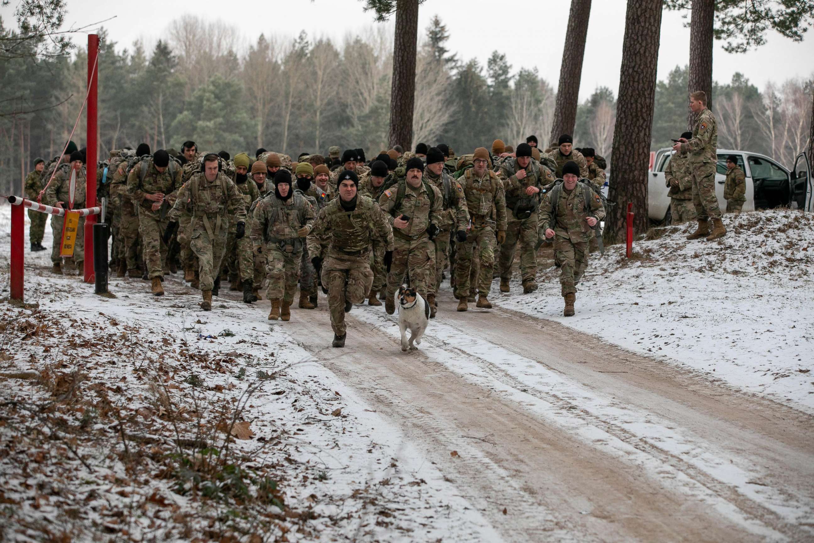 PHOTO: Soldiers of U.S.-led battle group Battle Group Poland march at Bemowo Piskie Training Area in Poland on Jan 26, 2022.