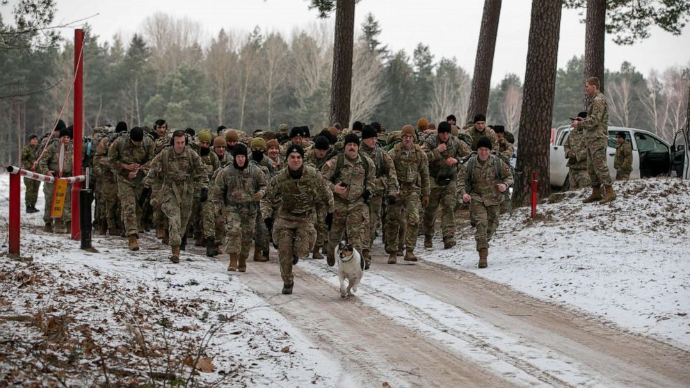 PHOTO: Soldiers of U.S.-led battle group Battle Group Poland march at Bemowo Piskie Training Area in Poland on Jan 26, 2022.
