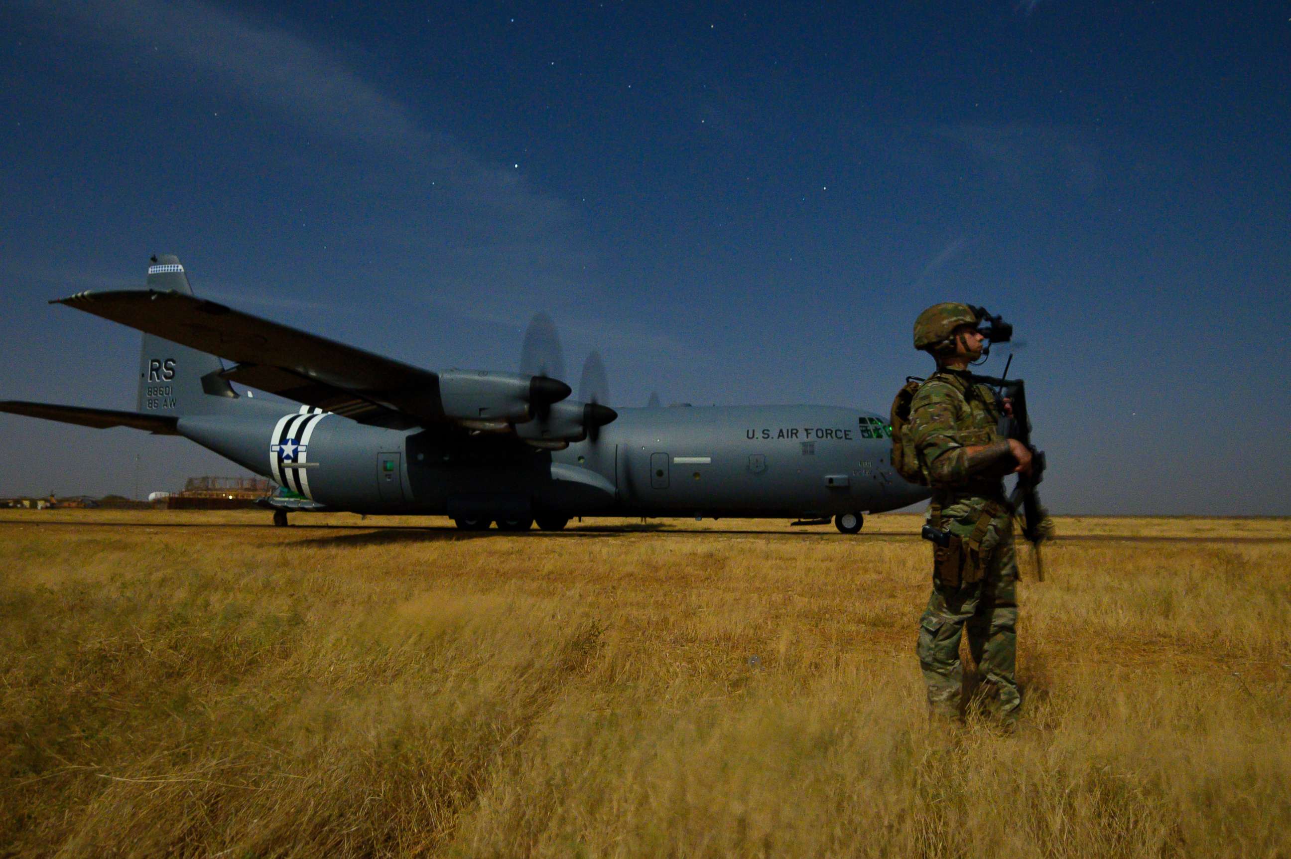 PHOTO: U.S. Army Spc. Christopher Andres provides security  during unloading and loading operations in Somalia, Feb. 6, 2020.