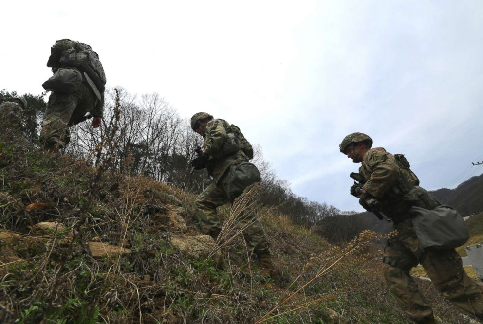 PHOTO: US soldiers move during a Stress Shoot test of the 2018 Best Warrior Competition at Camp Casey in Dongducheon, north of Seoul, Korea, April 10, 2018.